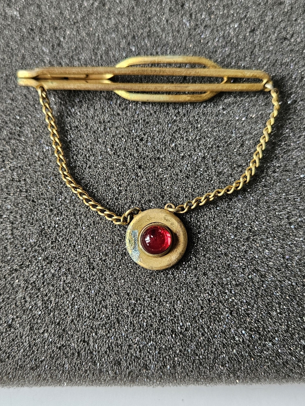 Gold-Tone Tie Bar with Red Accent Pendant.